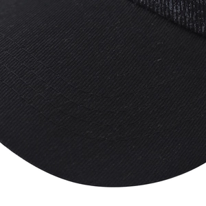 Detail of black twill cotton baseball cap brim with triple-row reinforced stitching
