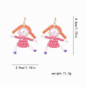 Detailed view of handmade beaded doll earrings showing size 4.4cm height and 2.9cm width