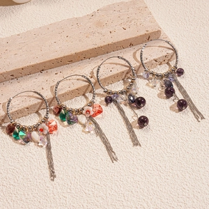 Bohemian twisted hoop earrings with colorful crystal beads and long metal tassels