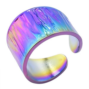 Detail of colorful iridescent stainless steel open ring with pleated ripple texture