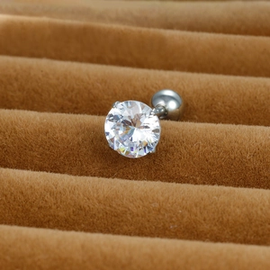 Macro shot of silver titanium steel stud earring with a clear round-cut cubic zirconia