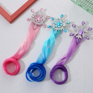 Detailed view of colorful snowflake hair clips with long curly synthetic fiber hair extensions