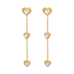 Detailed view of long gold tassel earrings with sparkling crystal heart pendants
