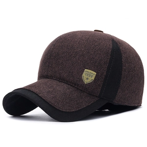 Mens winter baseball cap with ear flaps in brown and black with vintage badge detail