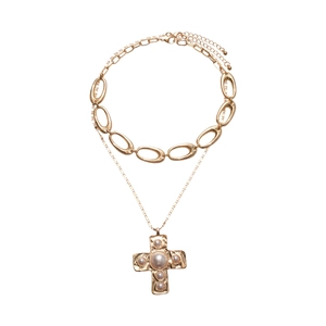 Double-layered gold cross pendant necklace with pearl embellishments and thick O-chain