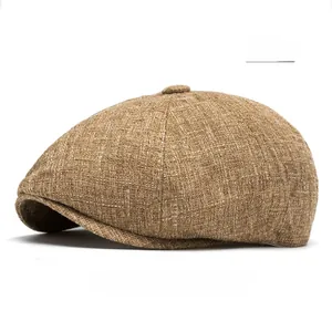 Detail of khaki linen flat cap showing breathable woven texture and top button finish