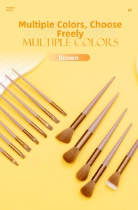 Detailed view of 13-piece makeup brush set with dusty pink handles and bronze ferrules