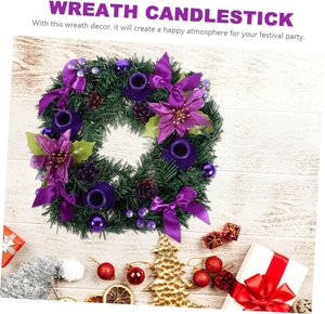Detailed top view of a green Christmas wreath candlestick with purple bows and pinecones