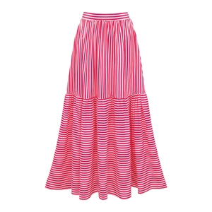 Detail of pink and white striped tiered maxi skirt with vertical and horizontal patterns