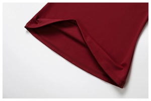 Detail of red quick-dry yoga t-shirt showing double-needle hem and knitted fabric texture