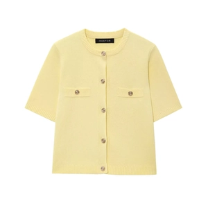 Detail of pale yellow short-sleeve knit cardigan with golden relief buttons on white background