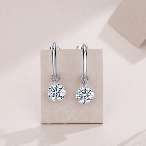 Detail view of S925 silver hoop earrings with brilliant round cut moissanite stones