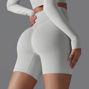Detail view of high-waist seamless yoga shorts featuring scrunch butt lifting texture