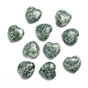 Set of nine heart-shaped green and white spotted natural jasper stones on white background