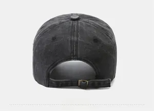 Detail of washed charcoal cotton baseball cap featuring an adjustable brass metal buckle