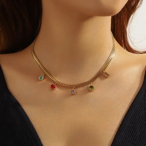 Gold stainless steel necklace with colorful geometric glass rhinestone pendants worn by model