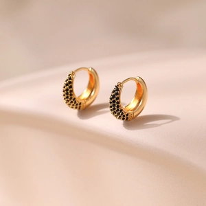 Detail of 18K gold-plated brass hoop earrings with micro-pave black zircon settings