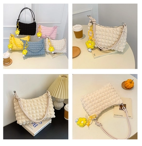 Detailed grid view of stylish pleated hobo bags in five colors with floral charms
