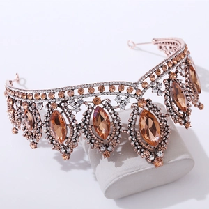 Close-up of baroque bridal crown featuring large amber crystals and sparkling rhinestones