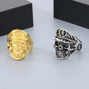 Punk style skull rings in gold and vintage silver finishes for men made of titanium steel