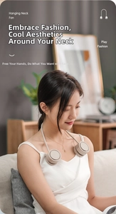Close-up of portable cream-colored hanging neck fan worn by model in a cozy home setting