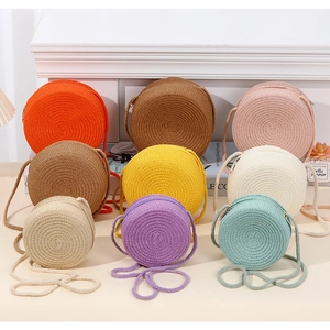 Detailed view of circular straw crossbody bags in nine vibrant summer colors with zippers