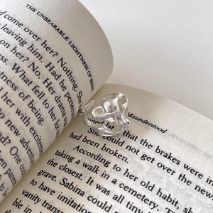 Minimalist S925 sterling silver irregular bubble ring with molten lava texture on book pages