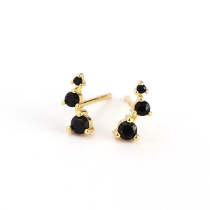 Elegant gold geometric stud earrings with three gradient black round zircons on white backdrop