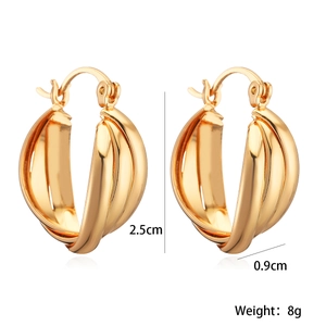 Detail view of gold twisted earrings with 2.5cm height and 0.9cm width measurements