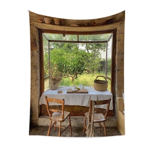 Bohemian tapestry featuring a vintage window view of lush garden and rustic dining setup