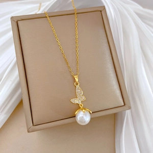 Elegant gold titanium steel necklace featuring a crystal butterfly and a large white pearl