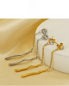 Detail of 18K vacuum plated fringe earrings in gold and silver finish, lead and nickel free
