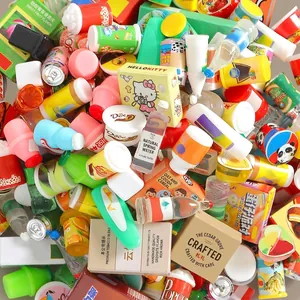 Macro view of assorted miniature resin beverage bottles and snack food dollhouse accessories