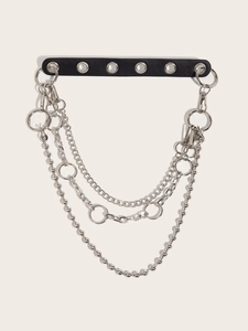 Detail view of punk style black leather choker with layered silver metal chains and rings