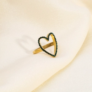 Detailed close-up of 18K gold-plated heart ring with inlaid green rhinestones on silk