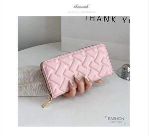 Detailed close-up of pink woven PU leather long wallet with golden zipper closure