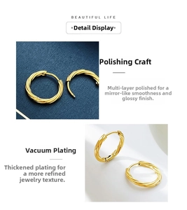 Detail of twisted gold earrings with vacuum plating and a high-polish mirror finish