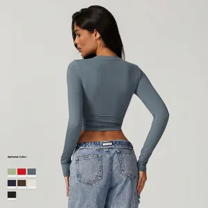 Women's tight long-sleeve athletic crop top in grey-blue with a slim fit crewneck design