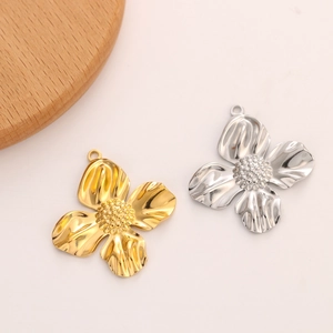 Detailed view of sunflower metal charms in gold and silver finish with textured center