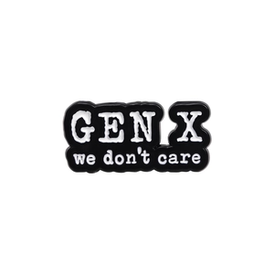 Gen X We Don't Care enamel brooch with white text on black geometric metal pin