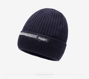 Detail of navy knit beanie with Naraon fashion patch and ribbed texture