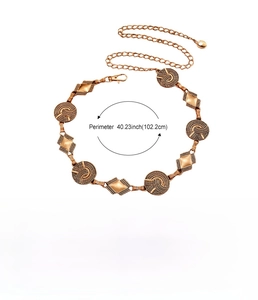 Macro detail of bronze bohemian metal chain belt showing dimensions and zinc alloy texture