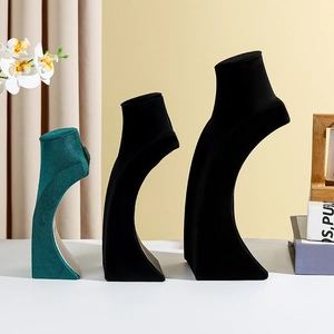 Velvet bust necklace display stands in black and dark green, featuring three heights