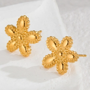 Elegant gold minimalist flower stud earrings with textured petals on a clean white base