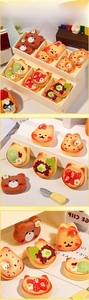 Detailed close-up of cartoon resin animal bread miniatures for DIY dollhouse accessories