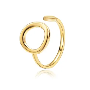 Adjustable open ring in golden stainless steel with minimalist round disk design