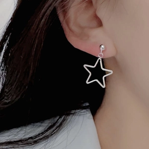 Minimalist S925 sterling silver hollow star drop earrings worn by a female model