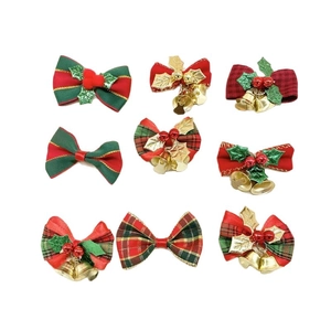 Set of 9 Christmas ribbon bows with gold bells, holly leaves and berries on white backdrop