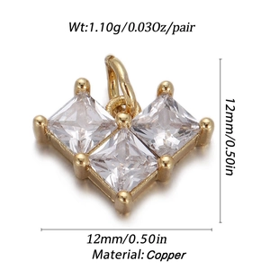 Close-up of a gold-plated charm featuring three square-cut sparkling zircons in a V-shape