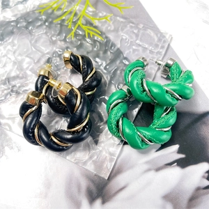Twisted leather and metal woven C-shape hoop earrings in black gold and green silver